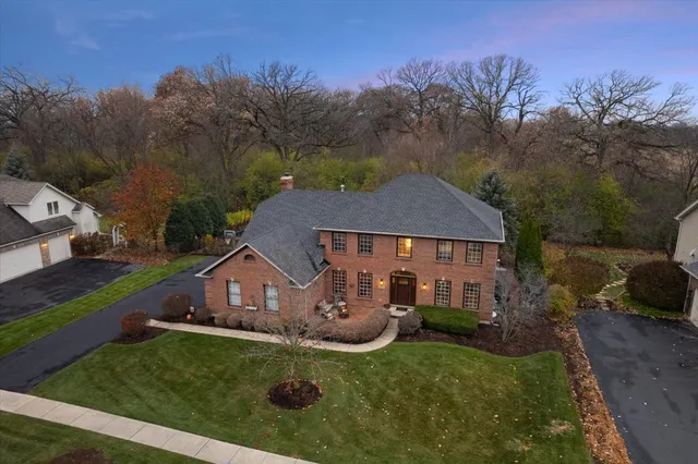 a view of a house with swimming pool and a yard