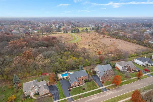 a view of a swimming pool with a lounge chair