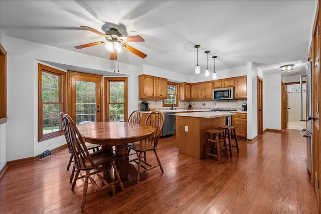 a view of a dining room with furniture window and wooden floor
