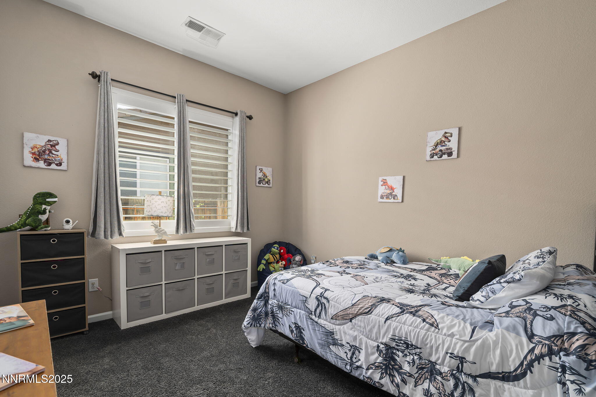 10035 Ellis Park Lane Reno, NV 89521 - Photo 22 of 52 a bedroom with a bed and a window