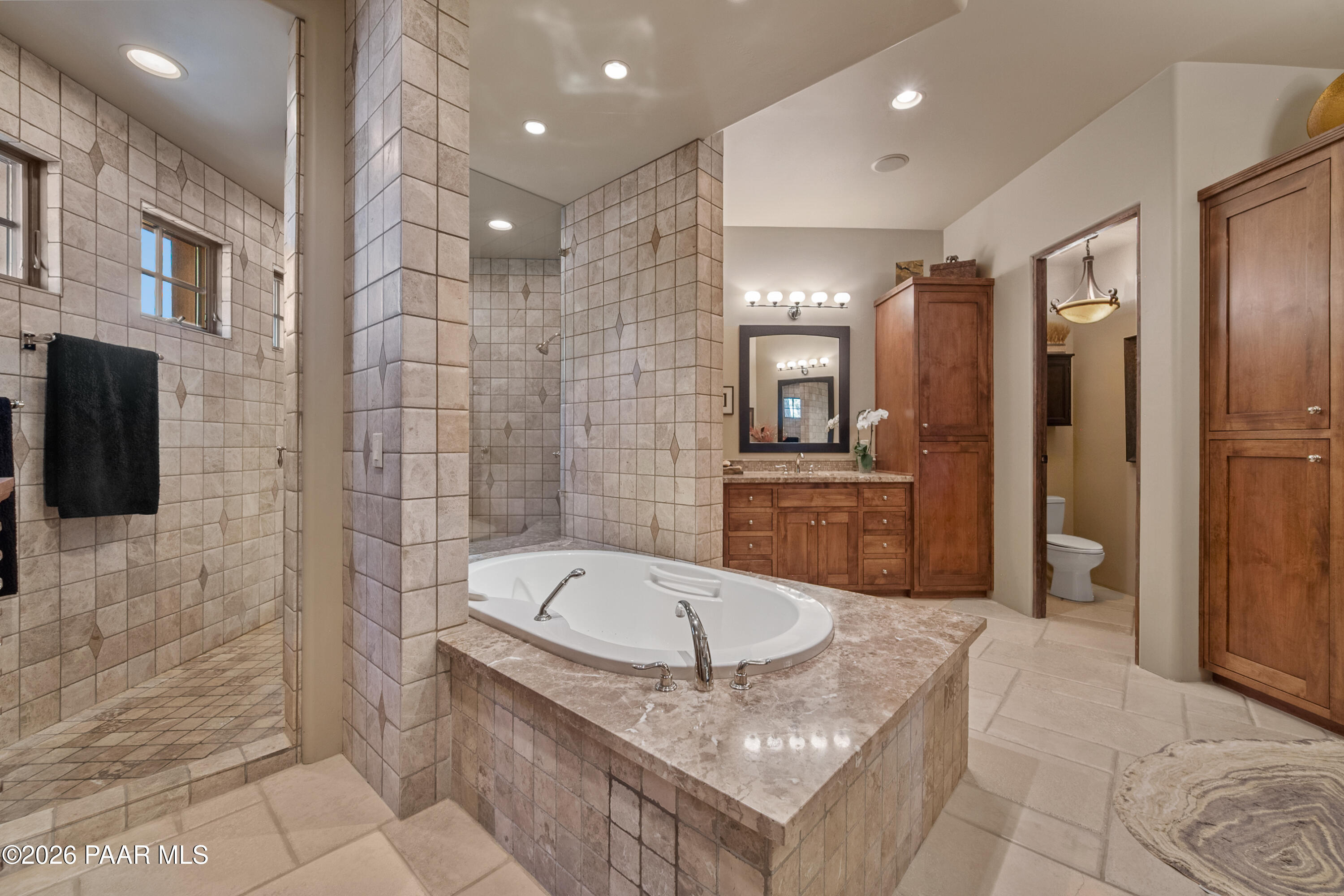 1515 High Valley Ranch Road Prescott, AZ 86303 - Photo 41 of 76 a bathroom with a tub a sink a mirror and a shower