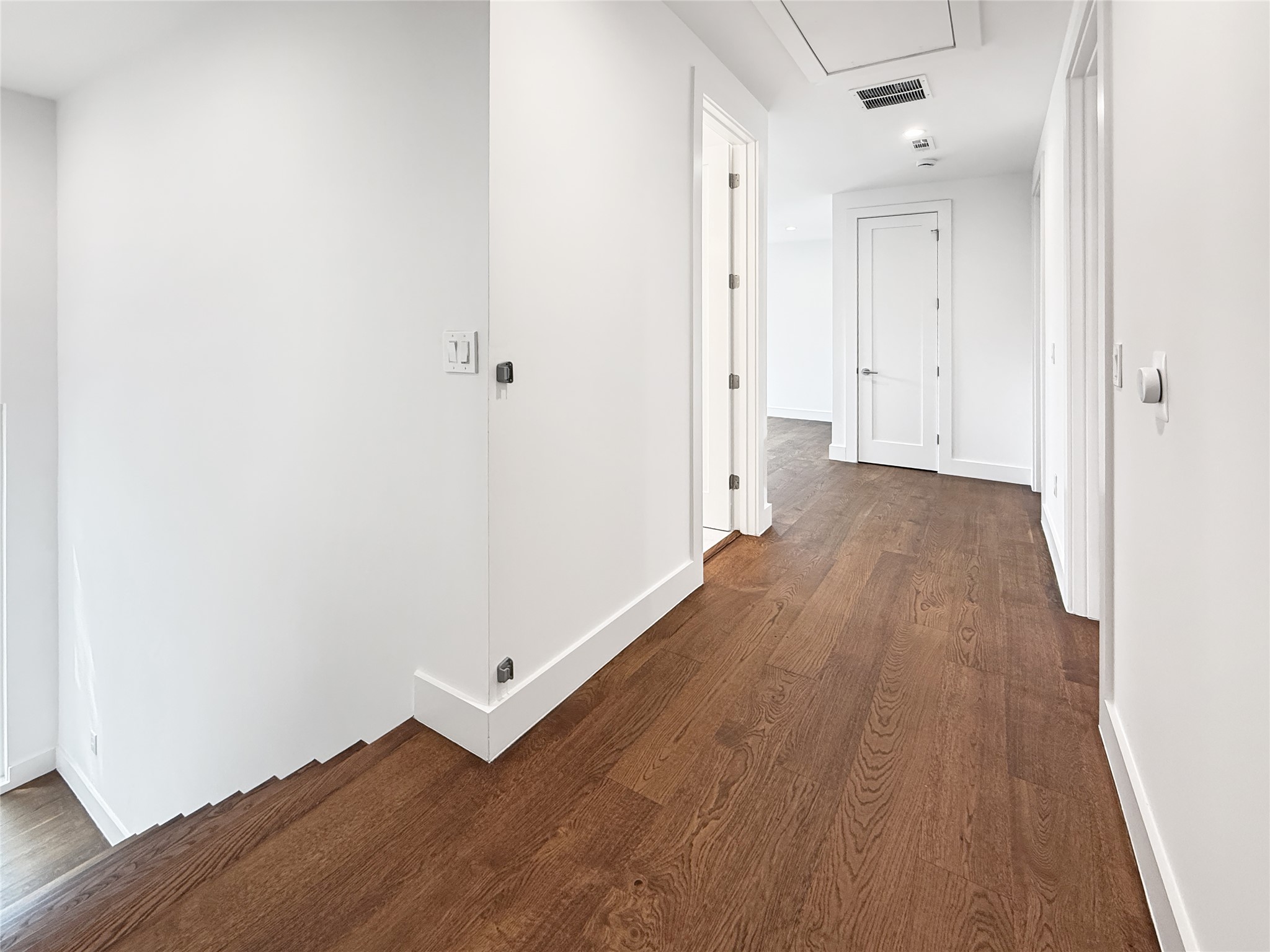 127 Frederick Street Austin, TX 78704 - Photo 23 of 34 Upstairs hallway towards loft. Guest bedrooms on the right