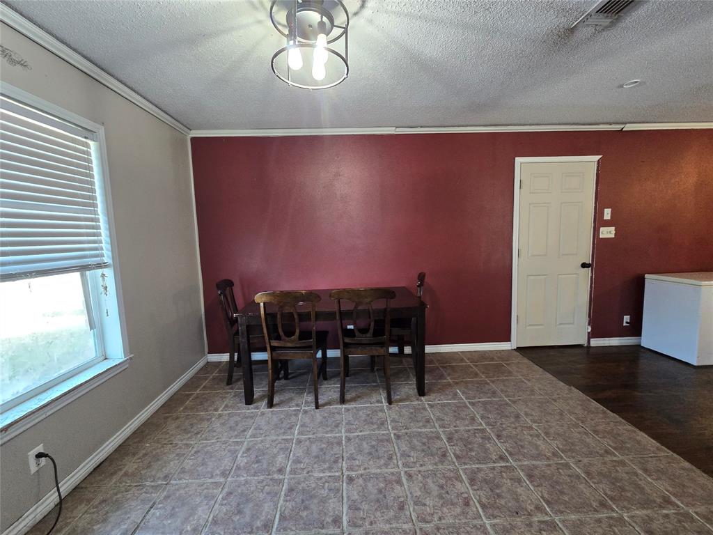 201 Robin Way Mount Vernon, TX 75457 - Photo 11 of 28 a view of a dining room with furniture
