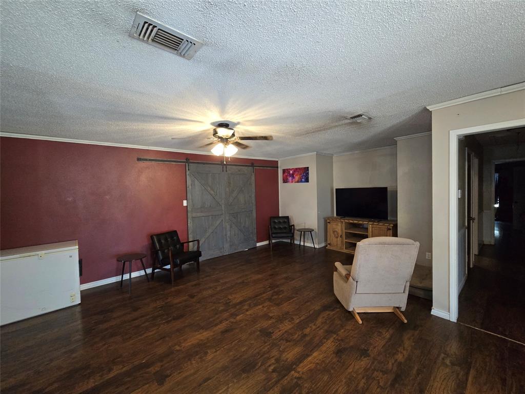 201 Robin Way Mount Vernon, TX 75457 - Photo 12 of 28 a living room with furniture and a flat screen tv