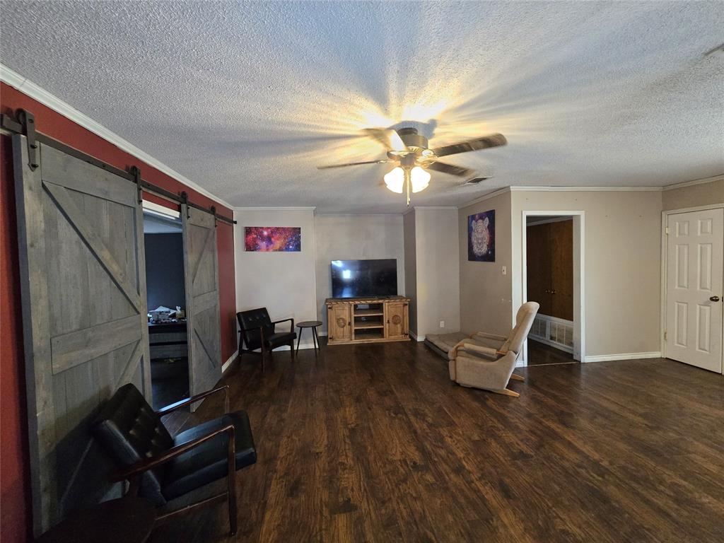 201 Robin Way Mount Vernon, TX 75457 - Photo 13 of 28 a living room with furniture and a flat screen tv