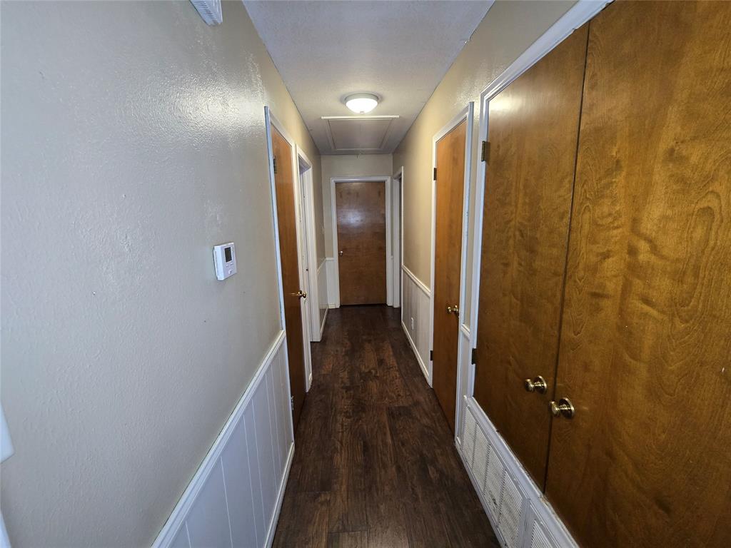 201 Robin Way Mount Vernon, TX 75457 - Photo 14 of 28 a view of a hallway with wooden floor