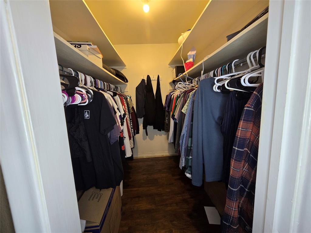 201 Robin Way Mount Vernon, TX 75457 - Photo 22 of 28 a view of walk in closet with clothes and shoes