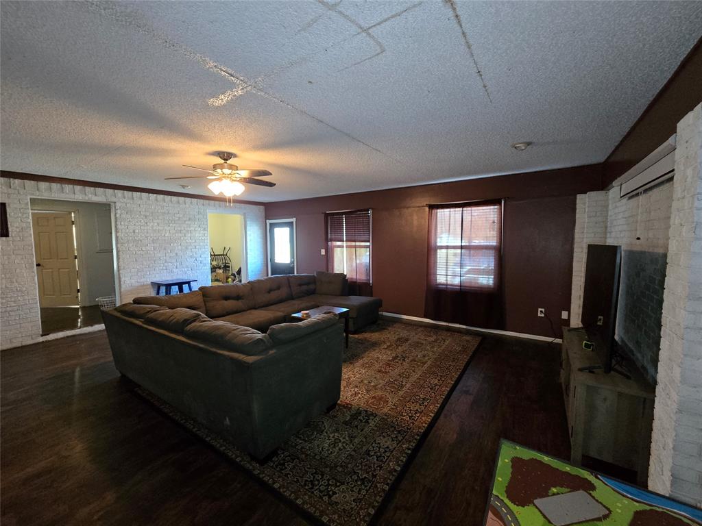 201 Robin Way Mount Vernon, TX 75457 - Photo 23 of 28 a living room with furniture and a window