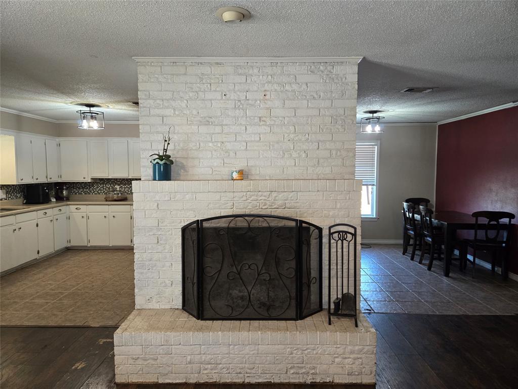 201 Robin Way Mount Vernon, TX 75457 - Photo 7 of 28 a living room with furniture and a fireplace