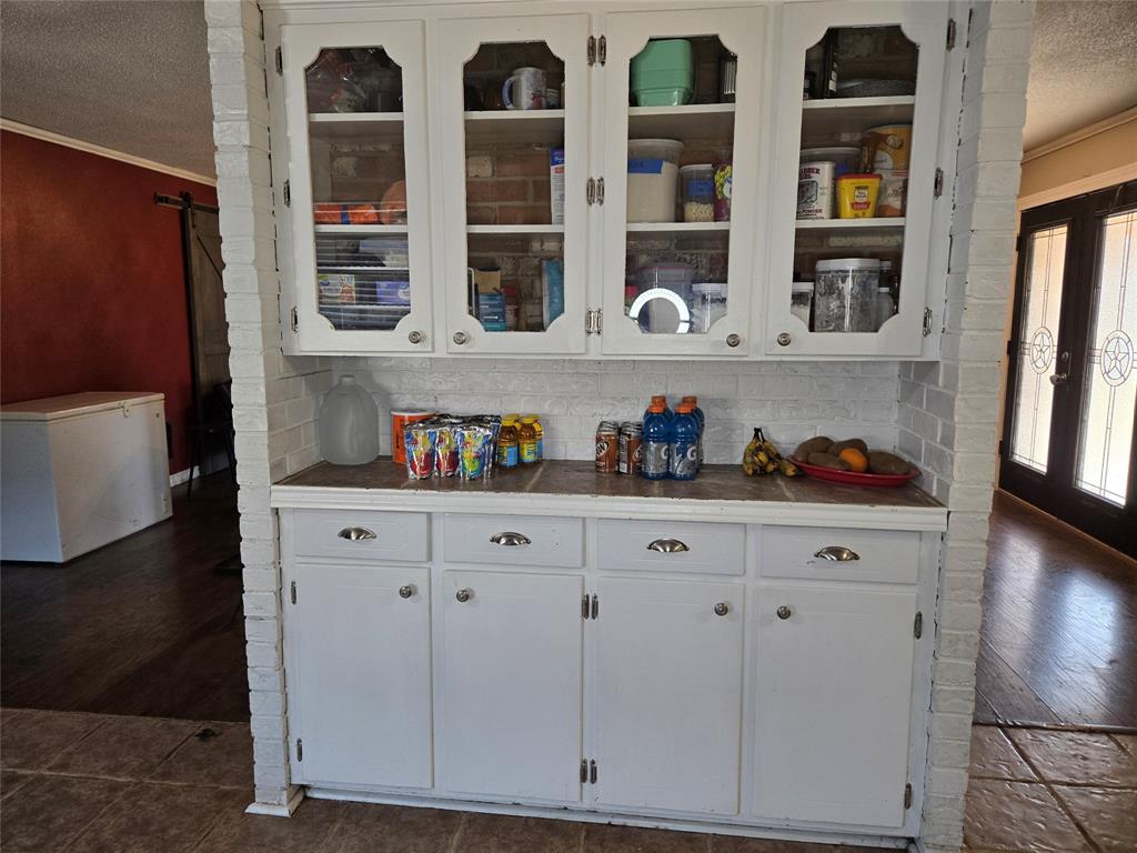 201 Robin Way Mount Vernon, TX 75457 - Photo 10 of 28 a kitchen with cabinets and window