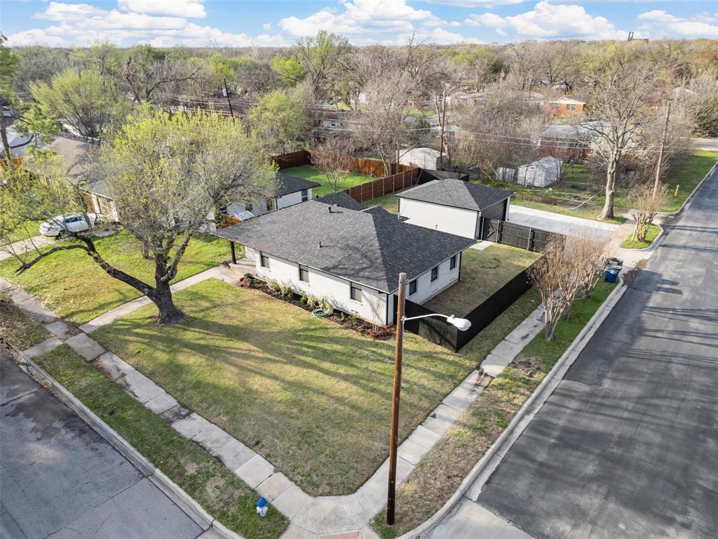 2945 Healey Drive Dallas, TX 75228 - Photo 35 of 38 a view of a house with a yard