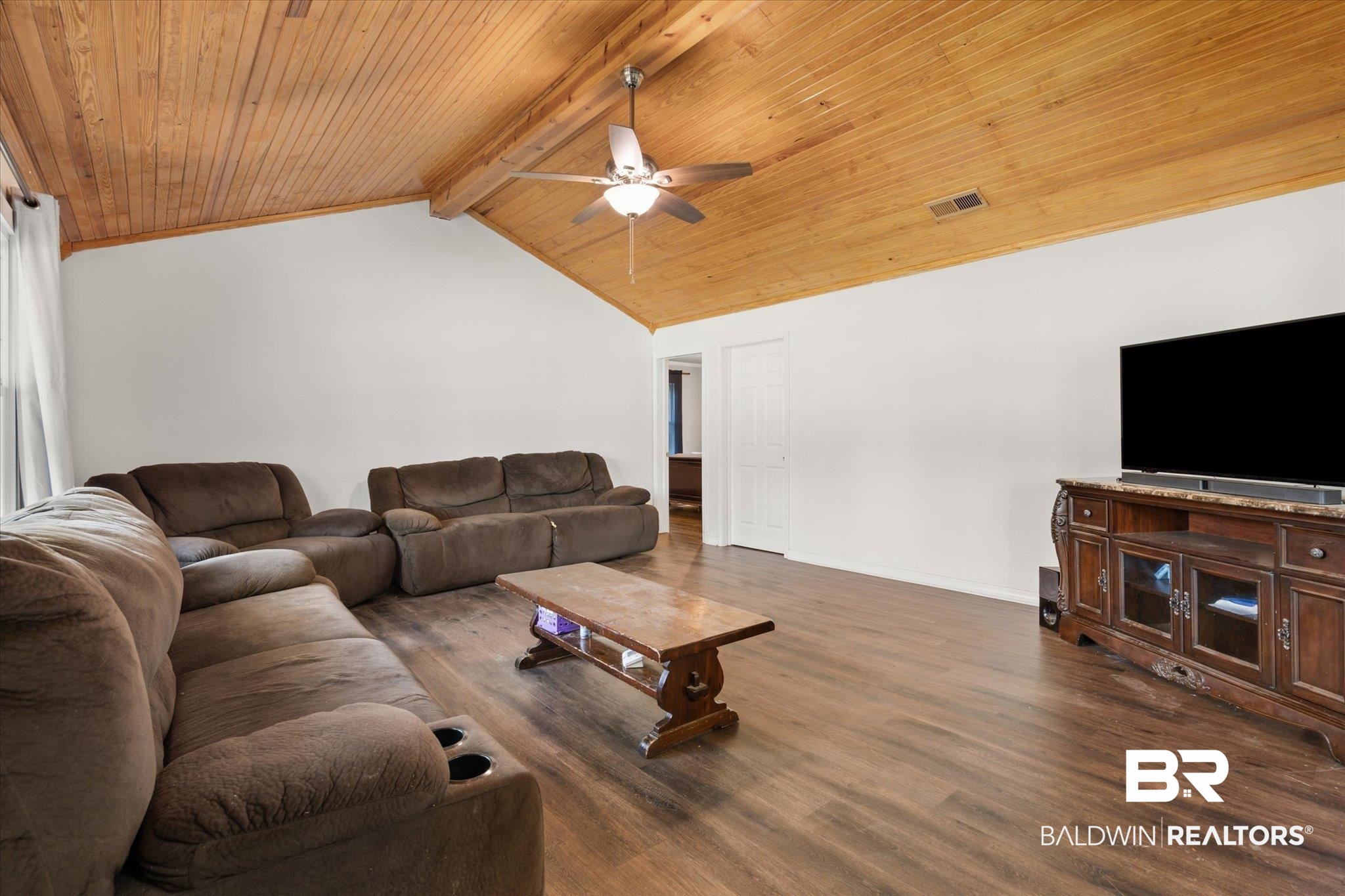 529 Cleveland Road Saraland, AL 36571 - Photo 4 of 31 Living room with visible vents, lofted ceiling with beams, ceiling fan, wood ceiling, and wood finished floors