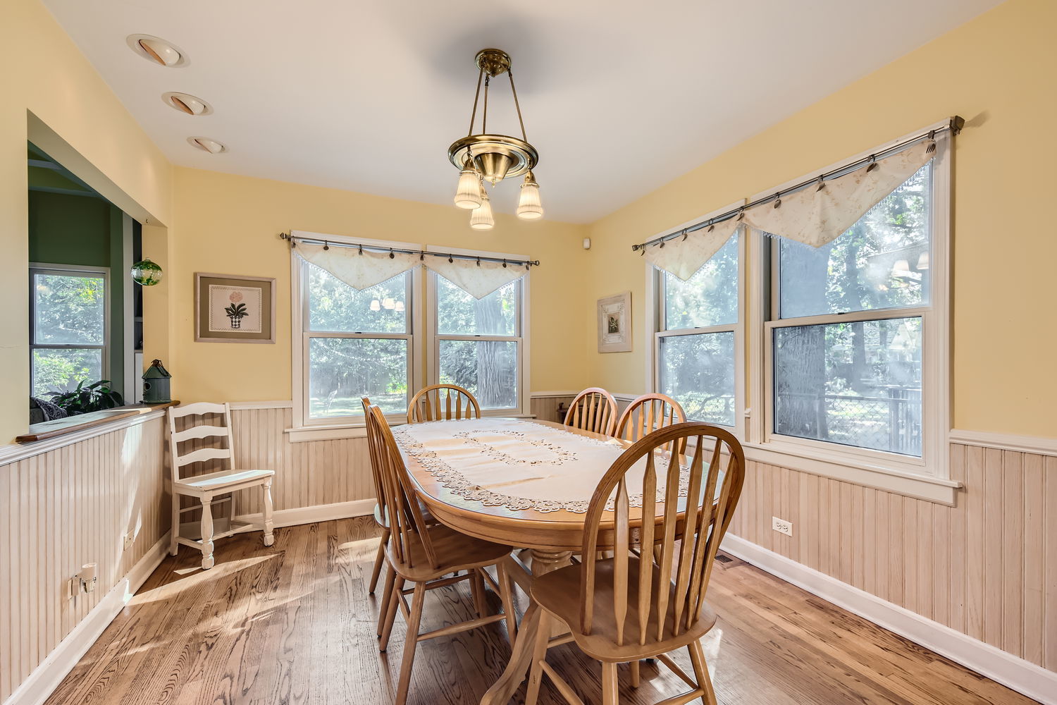 207 Scottswood Road Riverside, IL 60546 - Photo 12 of 32 a view of a dining room with furniture large window and wooden floor