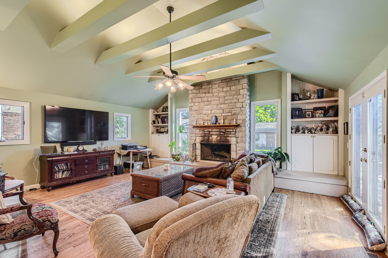 207 Scottswood Road Riverside, IL 60546 - Photo 13 of 32 a living room with furniture a flat screen tv and a fireplace
