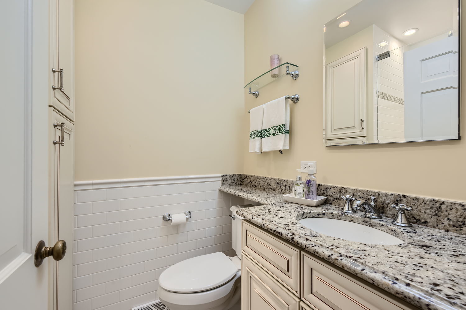 207 Scottswood Road Riverside, IL 60546 - Photo 18 of 32 a bathroom with a granite countertop sink a toilet and shower