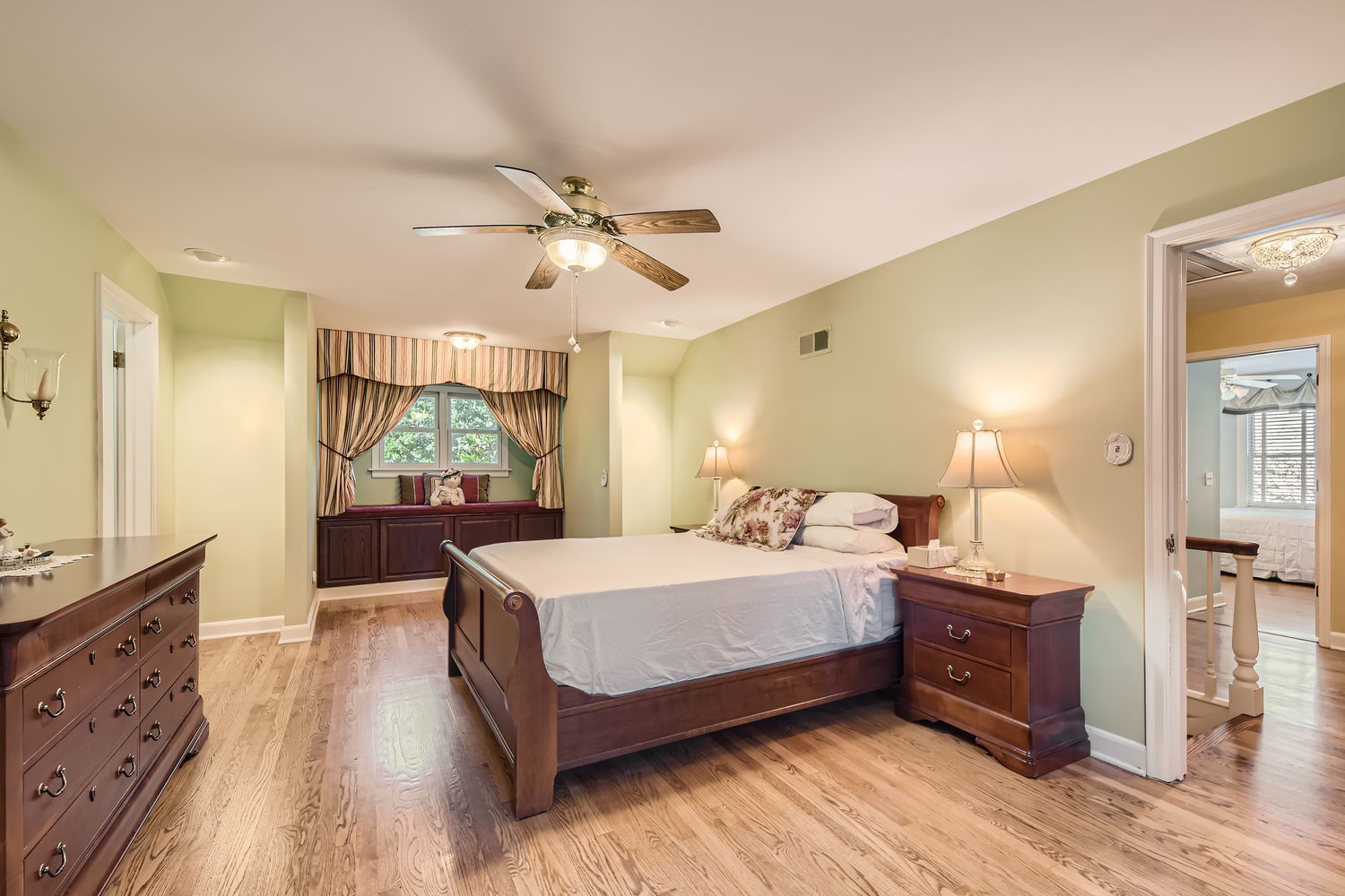 207 Scottswood Road Riverside, IL 60546 - Photo 19 of 32 a bedroom with a large bed and a flat tv screen on dresser