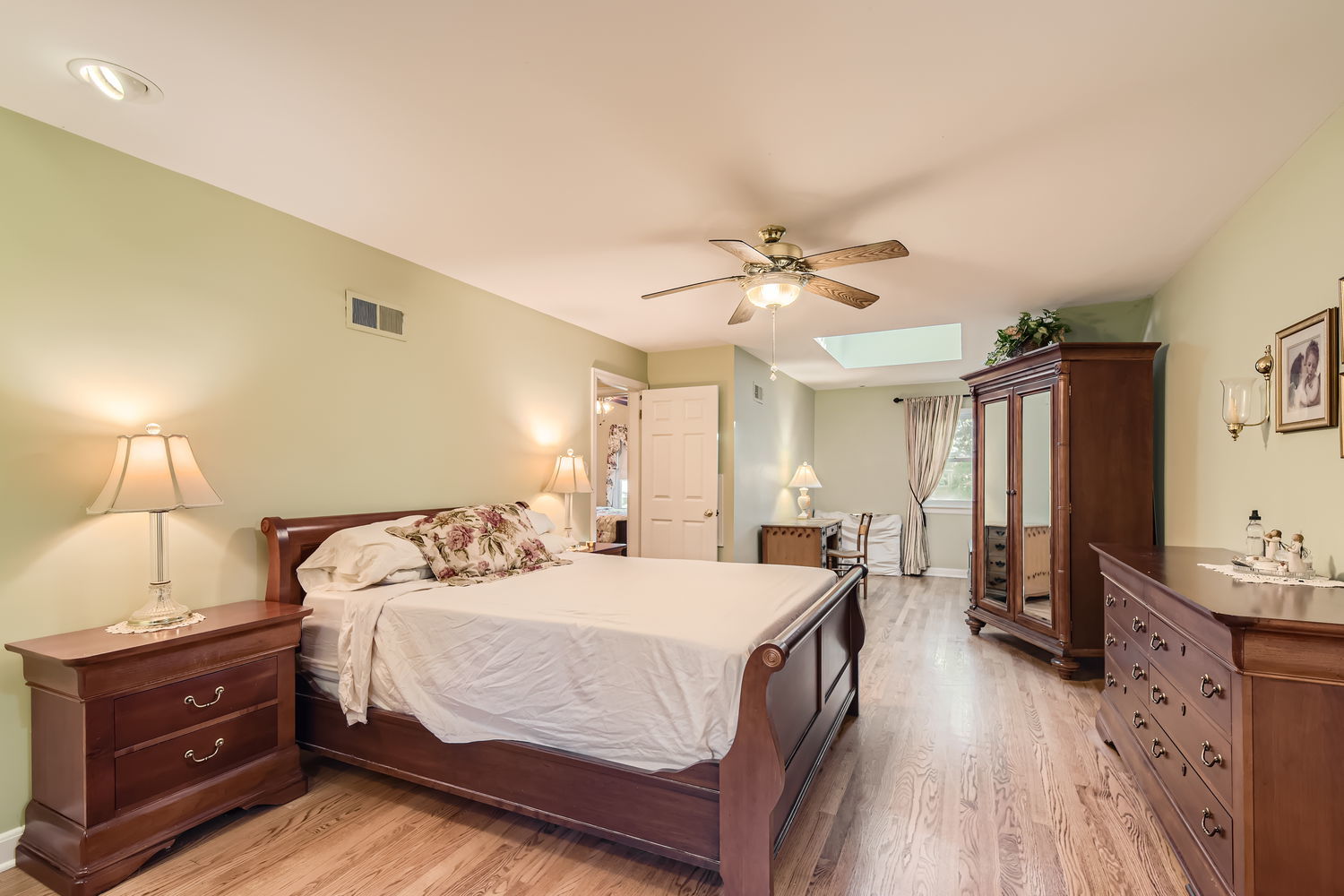 207 Scottswood Road Riverside, IL 60546 - Photo 20 of 32 a bedroom with a bed and a chandelier
