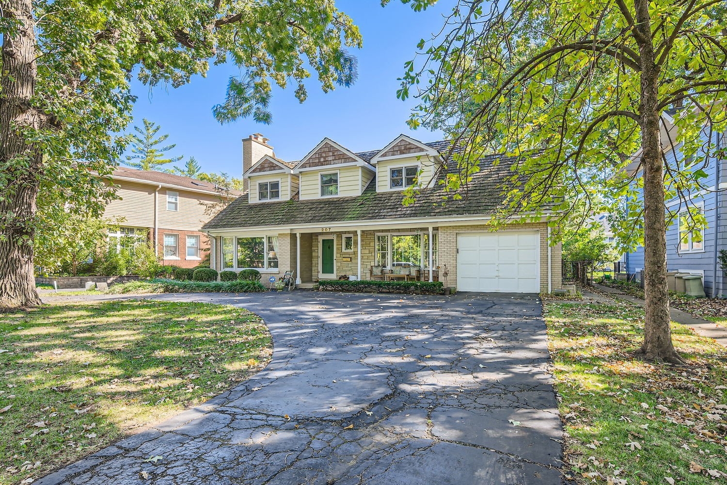 207 Scottswood Road Riverside, IL 60546 - Photo 2 of 32 a front view of a house with a garden