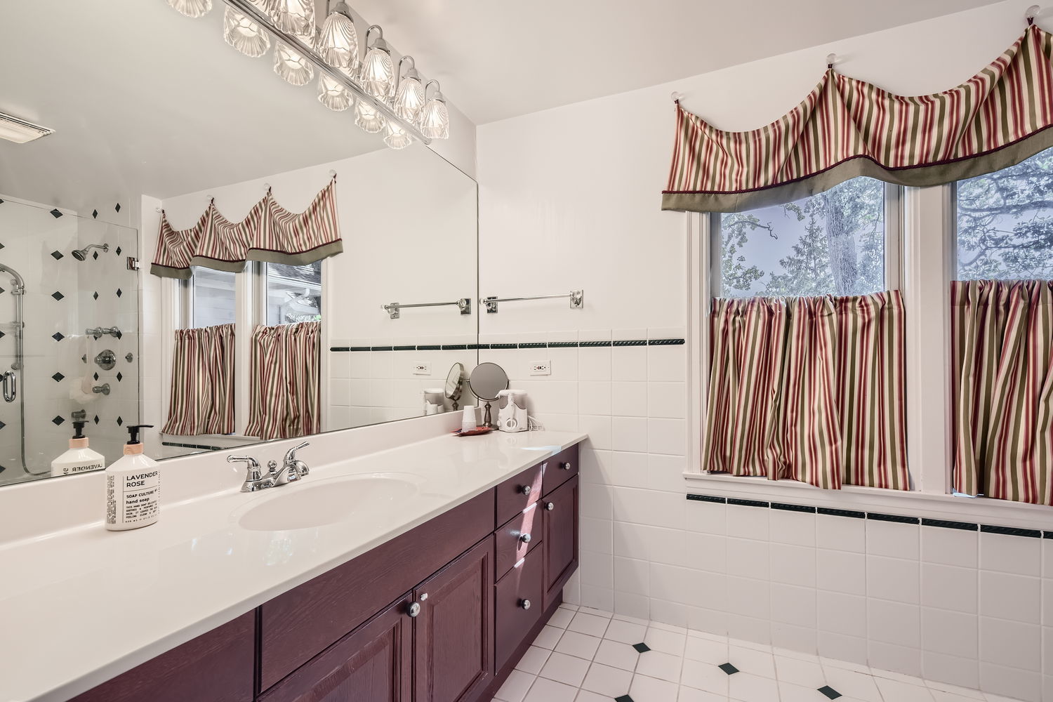 207 Scottswood Road Riverside, IL 60546 - Photo 21 of 32 a bathroom with a sink and a mirror