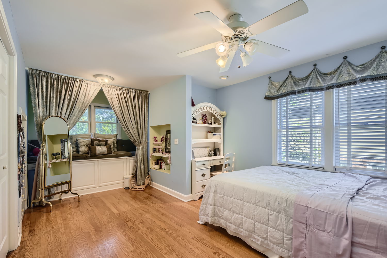 207 Scottswood Road Riverside, IL 60546 - Photo 23 of 32 a bedroom with a large bed and a chandelier