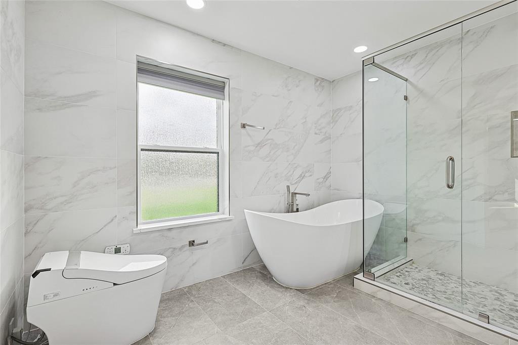 12417 Quincy Lane Dallas, TX 75230 - Photo 22 of 40 a bathroom with a sink toilet and shower