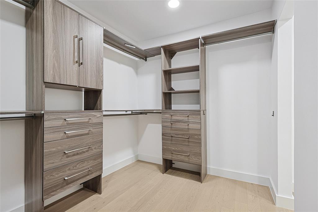 12417 Quincy Lane Dallas, TX 75230 - Photo 24 of 40 a view of walk in closet