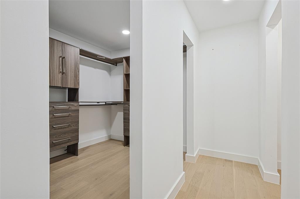12417 Quincy Lane Dallas, TX 75230 - Photo 25 of 40 a view of walk in closet with cabinet