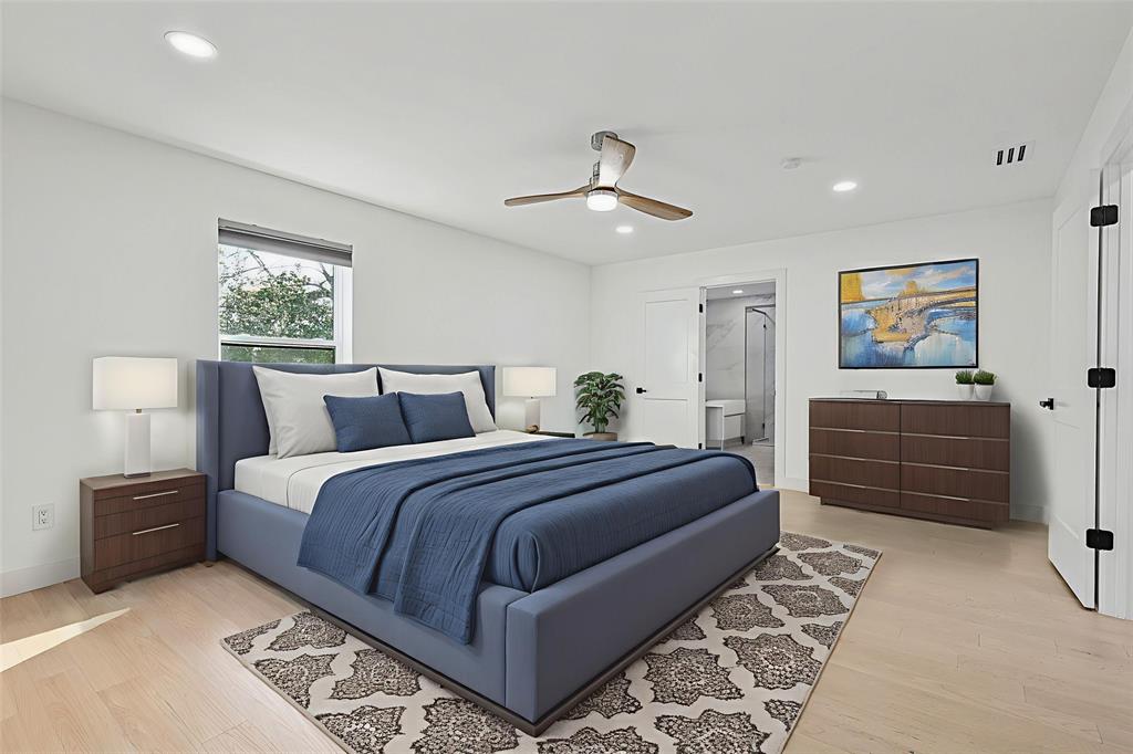 12417 Quincy Lane Dallas, TX 75230 - Photo 26 of 40 a bedroom with a large bed and a chandelier