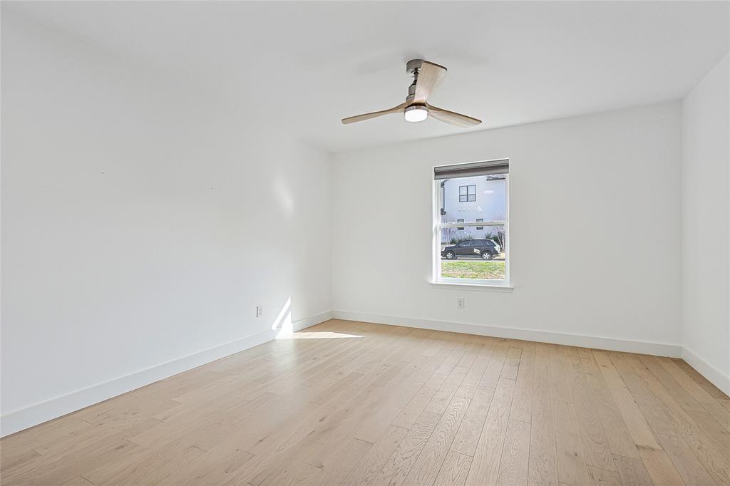 12417 Quincy Lane Dallas, TX 75230 - Photo 27 of 40 wooden floor in an empty room with a window