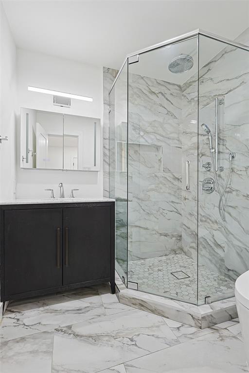 12417 Quincy Lane Dallas, TX 75230 - Photo 28 of 40 a bathroom with a shower and a sink