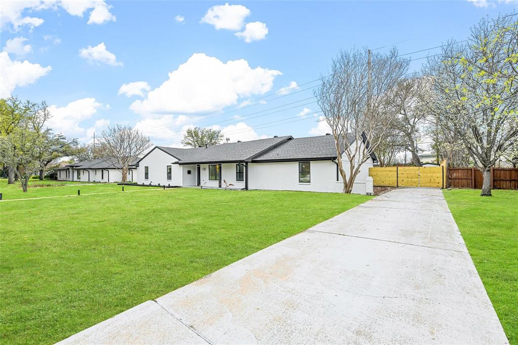 12417 Quincy Lane Dallas, TX 75230 - Photo 3 of 40 a view of house with a big yard