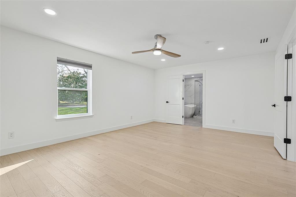 12417 Quincy Lane Dallas, TX 75230 - Photo 33 of 40 a view of an empty room with a window
