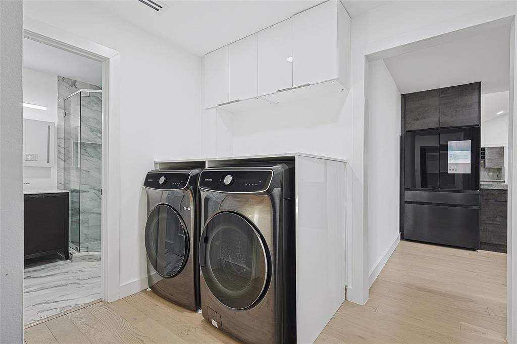 12417 Quincy Lane Dallas, TX 75230 - Photo 34 of 40 a view of a kitchen with washer and dryer
