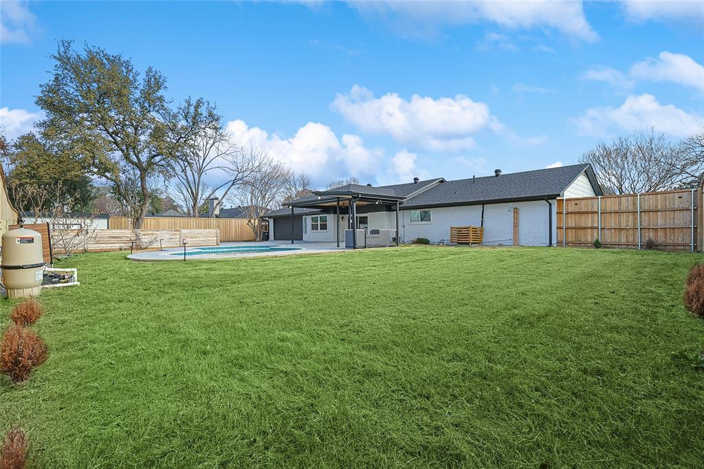 12417 Quincy Lane Dallas, TX 75230 - Photo 38 of 40 a view of a house with a big yard and large trees