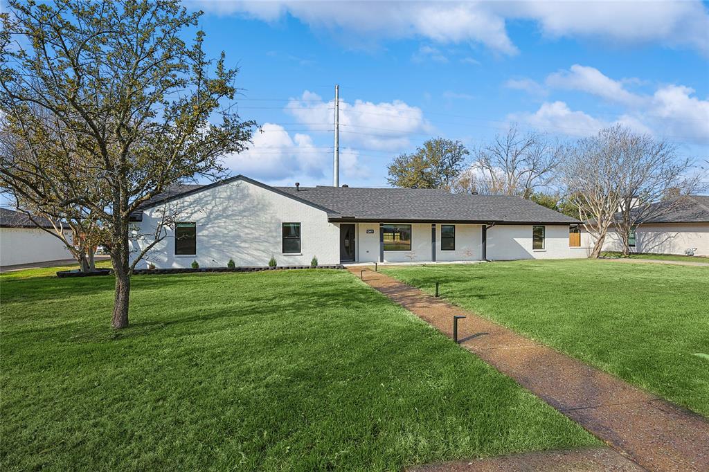 12417 Quincy Lane Dallas, TX 75230 - Photo 5 of 40 a view of a house with a big yard