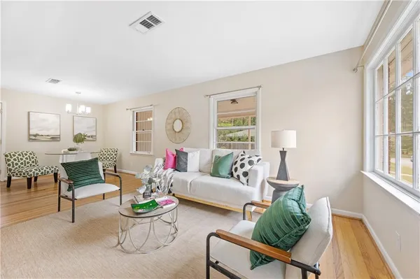 a living room with furniture and a table