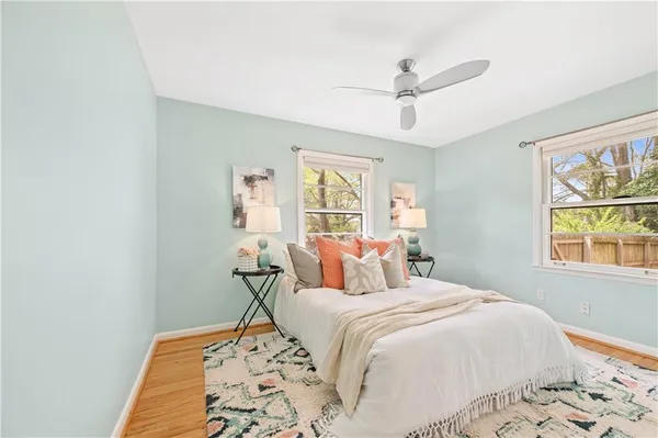 a bedroom with a large bed and a window