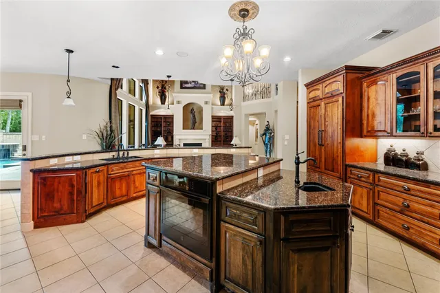 a stove top oven sitting inside of a kitchen