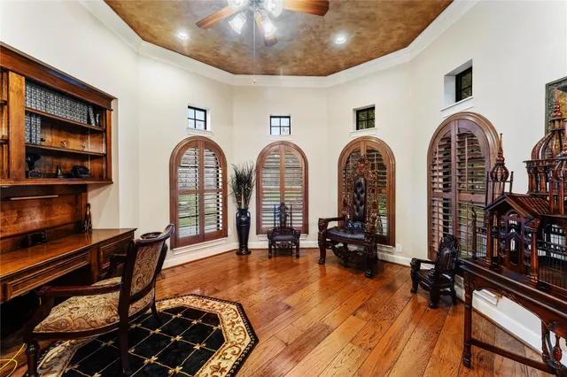 a sitting area with furniture and wooden floor