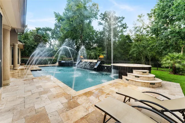 a view of a patio with swimming pool