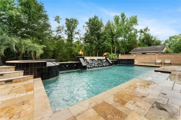 a view of a backyard with sitting area