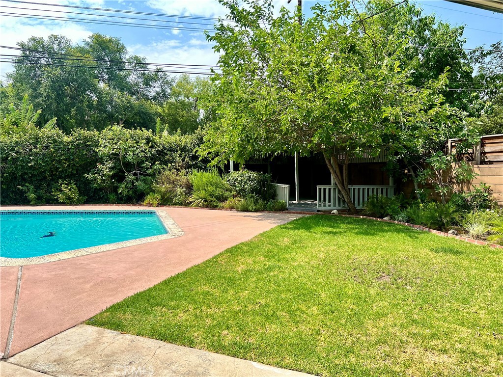 22734 Eccles Street West Hills, CA 91304 - Photo 13 of 19 a view of a backyard with a small cabin