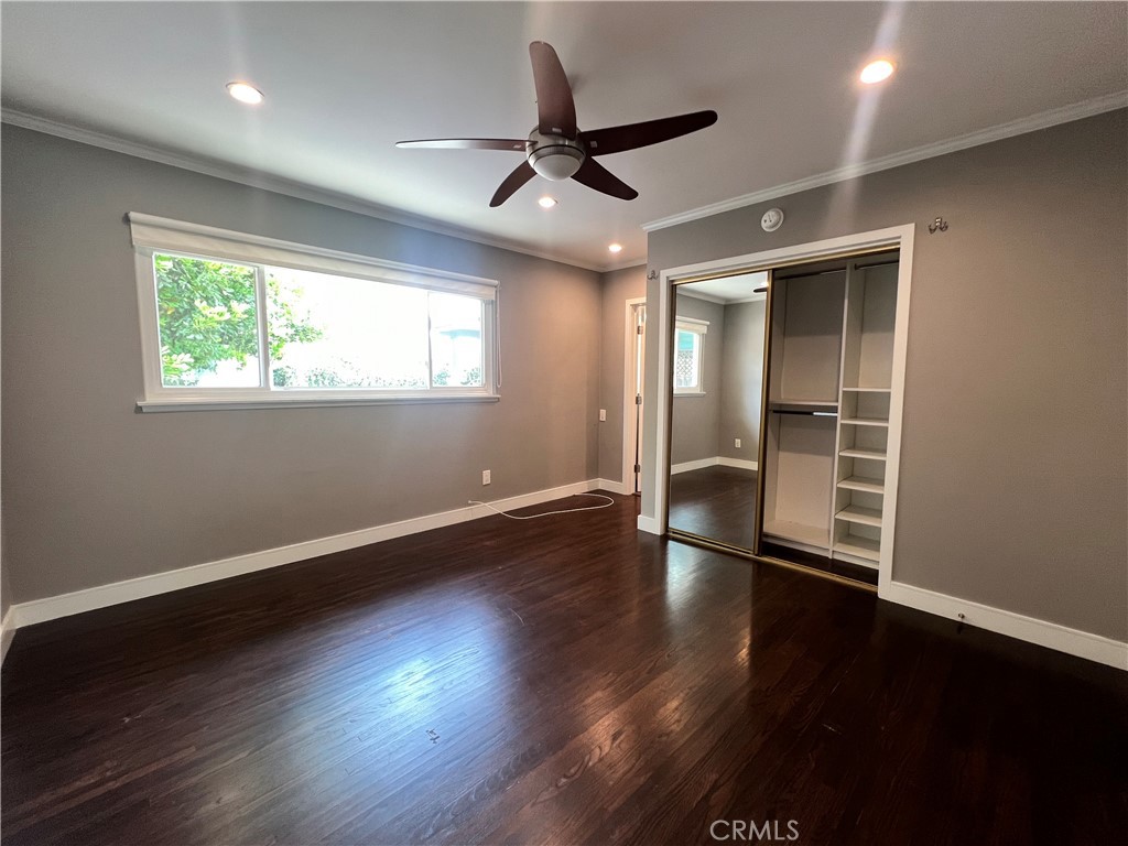 22734 Eccles Street West Hills, CA 91304 - Photo 3 of 19 a view of an empty room with wooden floor and a window