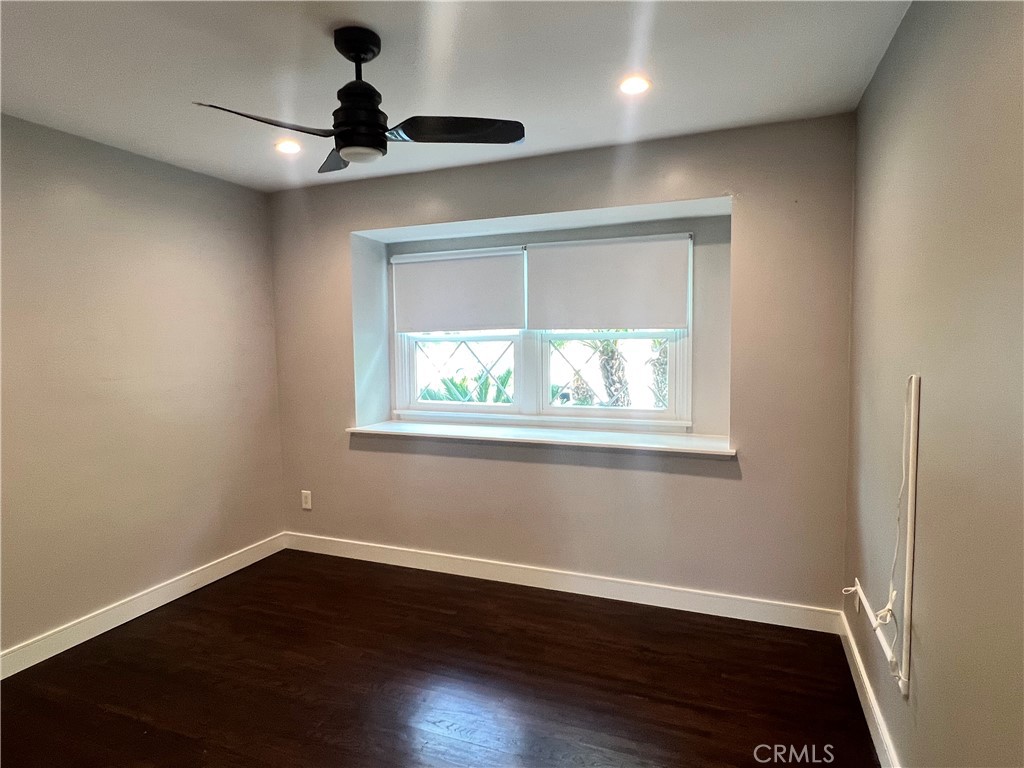 22734 Eccles Street West Hills, CA 91304 - Photo 4 of 19 a view of an empty room with wooden floor and a window