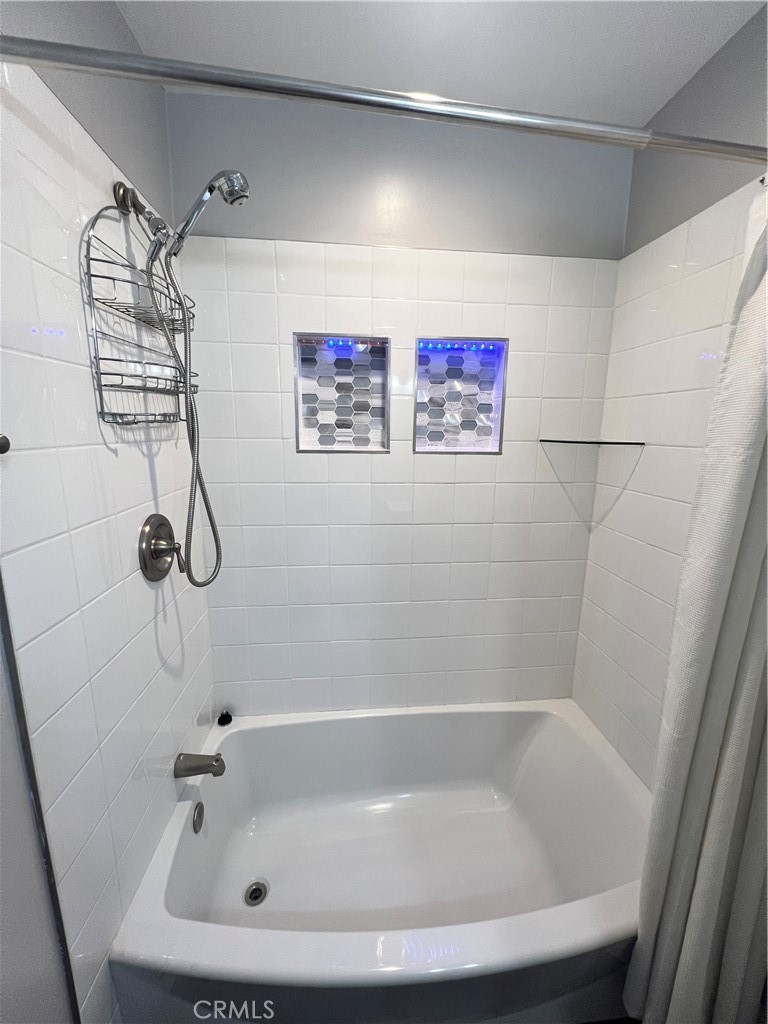 22734 Eccles Street West Hills, CA 91304 - Photo 6 of 19 a bathroom with a white bath tub