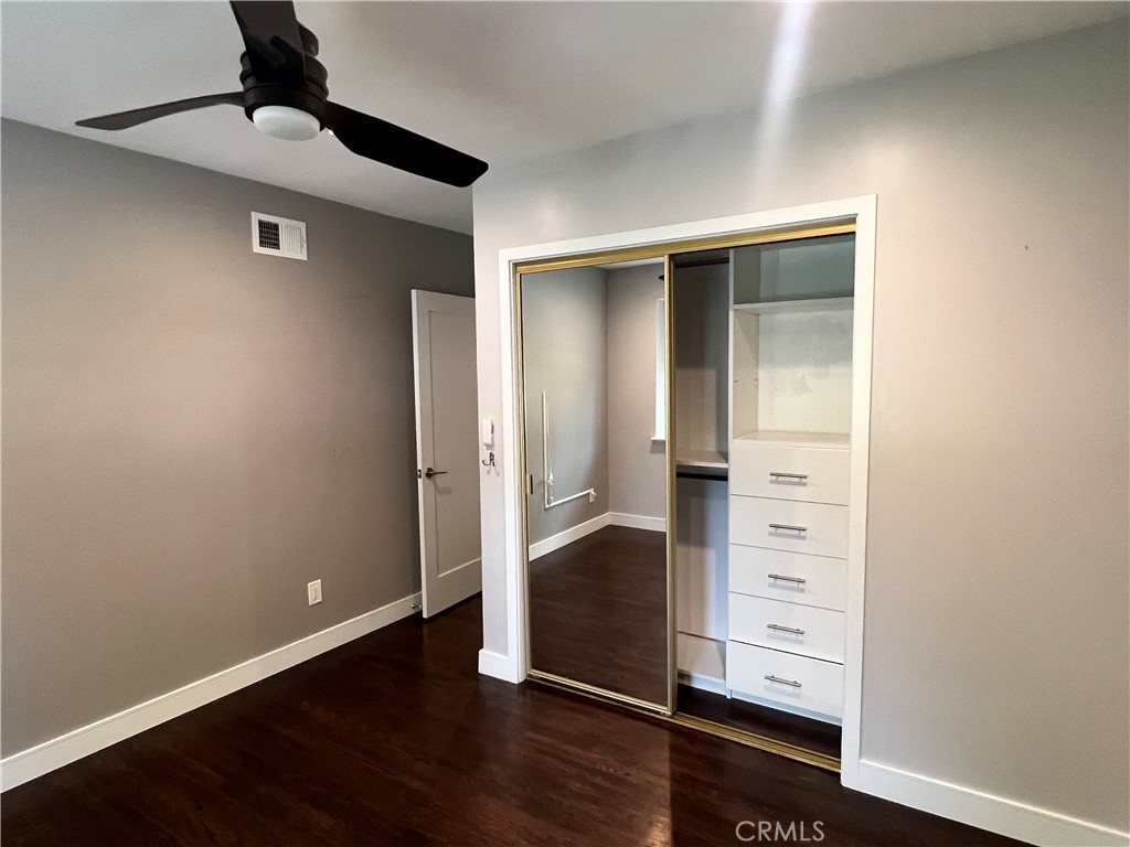 22734 Eccles Street West Hills, CA 91304 - Photo 7 of 19 a view of an empty room with wooden floor