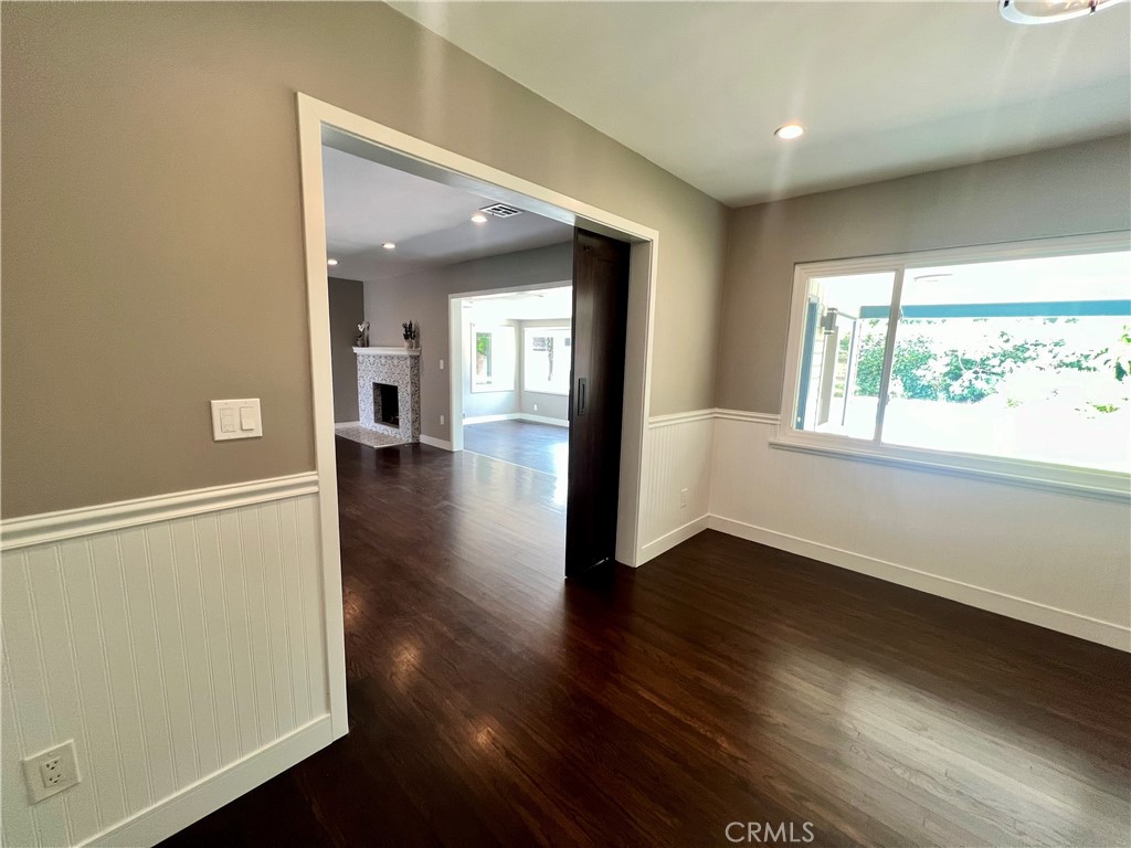22734 Eccles Street West Hills, CA 91304 - Photo 10 of 19 an empty room with wooden floor and windows