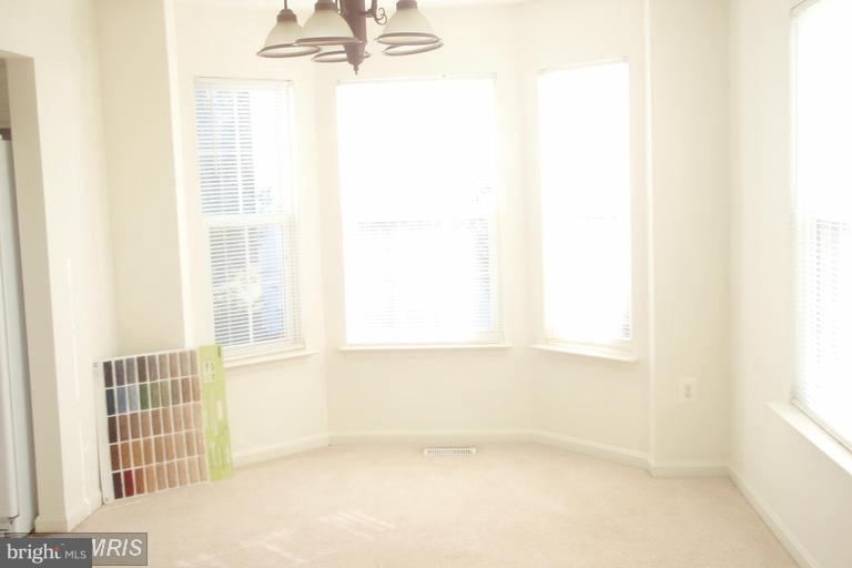 760 Holly Leaf Road Culpeper, VA 22701 - Photo 2 of 26 a view of empty room with windows