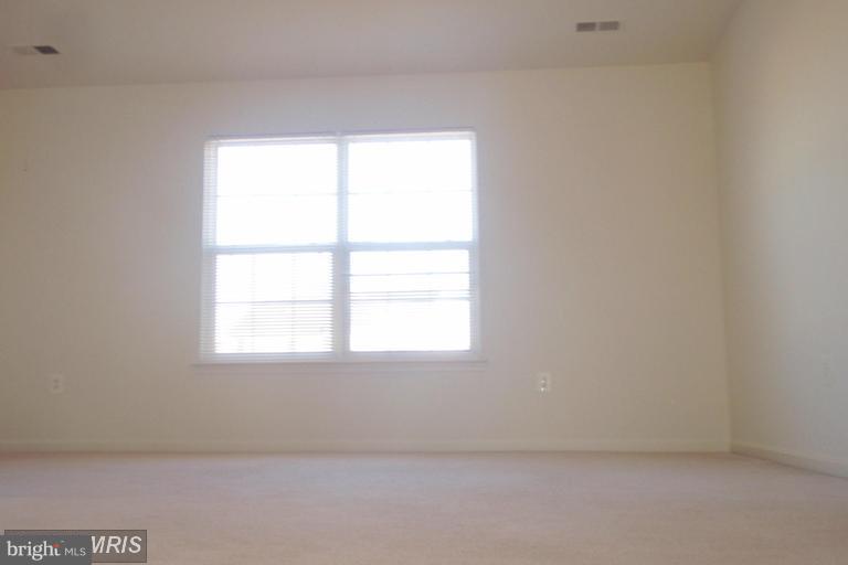 760 Holly Leaf Road Culpeper, VA 22701 - Photo 11 of 26 an empty room with a window
