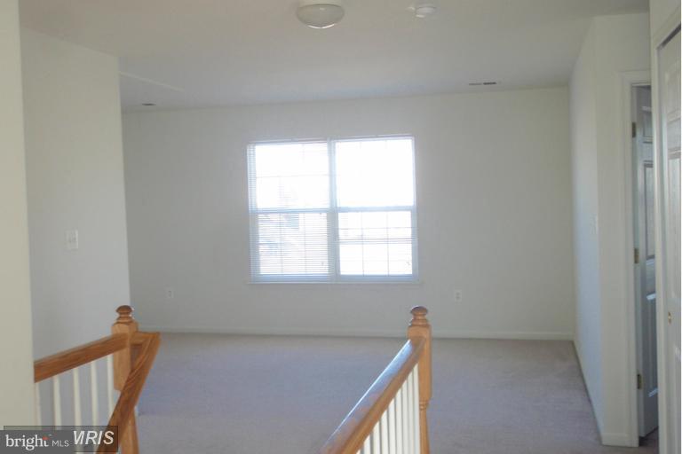 760 Holly Leaf Road Culpeper, VA 22701 - Photo 17 of 26 a view of an empty room with a window